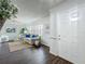 Bright living room with dark wood floors, fresh paint, large windows, decor and modern furniture at 670 Oleander St, Mount Dora, FL 32757