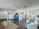 The living room shows an open floorplan with lots of natural light and modern ceiling fan at 670 Oleander St, Mount Dora, FL 32757