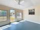 Bright sunroom featuring natural light, ceiling fan, and access to the outdoors at 670 Oleander St, Mount Dora, FL 32757