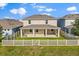 An aerial view shows the home's backyard with a covered patio and fenced-in yard at 674 Anna Ridge Rd, Minneola, FL 34715