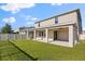 The home has a covered patio and a large fenced backyard at 674 Anna Ridge Rd, Minneola, FL 34715