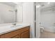 Bright bathroom featuring a wood vanity, a large mirror, and a shower-tub combination at 674 Anna Ridge Rd, Minneola, FL 34715
