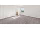 Bright bedroom with a double door closet, natural light, and neutral finishes at 674 Anna Ridge Rd, Minneola, FL 34715