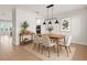 Bright dining room with modern lighting, stylish furniture, and elegant decor at 674 Anna Ridge Rd, Minneola, FL 34715