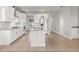 The kitchen features granite countertops, stainless steel appliances, and white cabinetry at 674 Anna Ridge Rd, Minneola, FL 34715