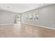 Spacious living room with tile flooring, large windows, and sliding glass door at 674 Anna Ridge Rd, Minneola, FL 34715