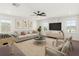 Living room area featuring a sofa, chairs, television, and foosball table at 674 Anna Ridge Rd, Minneola, FL 34715