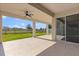The covered patio has a ceiling fan, and sliding glass doors to the home's interior at 674 Anna Ridge Rd, Minneola, FL 34715