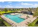 An aerial shot of the community pool and surrounding lounge area with chairs at 674 Anna Ridge Rd, Minneola, FL 34715