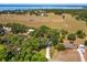 Expansive property with a well-maintained home surrounded by lush trees and a yellow property line at 6750 Sunnyside Dr, Leesburg, FL 34748