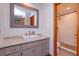 Bathroom featuring a granite vanity top and an enclosed shower with floor to ceiling tile at 6750 Sunnyside Dr, Leesburg, FL 34748