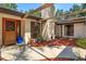 Front door and pergola with landscaping, providing a welcoming entrance and curb appeal at 6750 Sunnyside Dr, Leesburg, FL 34748