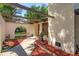 Charming front entrance with a wooden door and colorful landscaping, creating a warm and inviting welcome at 6750 Sunnyside Dr, Leesburg, FL 34748