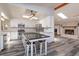 Bright kitchen with white cabinets, a center island with seating, and stainless steel appliances at 6750 Sunnyside Dr, Leesburg, FL 34748