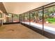 Spacious screened-in lanai with a view of the backyard and plenty of room for outdoor seating and entertaining at 6750 Sunnyside Dr, Leesburg, FL 34748