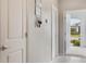 Bright entryway with coat rack and view of the front porch at 6816 Perch Hammock Loop, Groveland, FL 34736