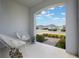 Inviting covered front porch with modern seating, perfect for relaxing outdoors at 6816 Perch Hammock Loop, Groveland, FL 34736