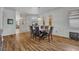 A formal dining area with wood-look flooring and a pendant light fixture at 684 Grand Canal Dr, Kissimmee, FL 34759