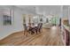 Dining room with views into the living room and featuring wood look floors at 684 Grand Canal Dr, Kissimmee, FL 34759