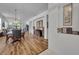 Dining room with views into the living room and featuring wood look floors at 684 Grand Canal Dr, Kissimmee, FL 34759