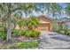 Charming single-story home with a well-manicured lawn and a paver driveway at 684 Grand Canal Dr, Kissimmee, FL 34759