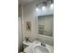 Bathroom vanity showcasing a sink, framed mirror, and decor that enhances the space's aesthetic appeal at 7394 Lussier Ct, The Villages, FL 34762