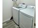A convenient laundry area equipped with a modern washer and dryer set for efficient home care at 7394 Lussier Ct, The Villages, FL 34762