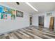 Spacious basement area with stylish wood-look flooring and freshly painted walls at 800 Jefferis Ct, Eustis, FL 32726