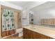 Bathroom featuring patterned shower curtain, and wood vanity at 800 Jefferis Ct, Eustis, FL 32726