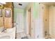 Bathroom featuring double vanity, shower and tub combo, and wood accents at 800 Jefferis Ct, Eustis, FL 32726