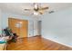 Cozy bedroom with wood floors, a closet, and access to an adjacent room at 800 Jefferis Ct, Eustis, FL 32726