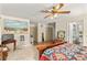 Bedroom featuring decorative bed frame, double closets, and carpet flooring at 800 Jefferis Ct, Eustis, FL 32726