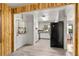 Open kitchen layout with modern appliances and stylish wooden accents at 800 Jefferis Ct, Eustis, FL 32726