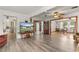 Spacious living room featuring an open layout and wood-look flooring at 800 Jefferis Ct, Eustis, FL 32726