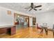Open living room featuring hardwood floors and seamless flow to kitchen at 800 Jefferis Ct, Eustis, FL 32726
