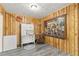 Unique room showcasing wood paneling, an artistic touch, and ample storage at 800 Jefferis Ct, Eustis, FL 32726