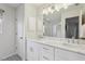 This bright bathroom features a double vanity with framed mirror and walk-in shower at 802 San Salvador Dr, The Villages, FL 32159