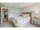 Bedroom featuring a large bed, overhead fan, and side table at 802 San Salvador Dr, The Villages, FL 32159