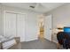 Bedroom with a large closet, comfortable seating, and neutral tones, creating a calming atmosphere at 802 San Salvador Dr, The Villages, FL 32159