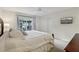 Relaxing bedroom boasts a large window and backyard view at 802 San Salvador Dr, The Villages, FL 32159