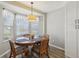 Bright breakfast nook with round table and bay window at 802 San Salvador Dr, The Villages, FL 32159