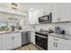 Renovated kitchen features stainless steel appliances, subway tile and new countertops at 802 San Salvador Dr, The Villages, FL 32159