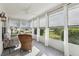 Inviting sunroom filled with natural light, comfortable seating, and views of the outdoors at 802 San Salvador Dr, The Villages, FL 32159