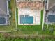 Aerial view of the home features a manicured yard, patio, and a swimming pool with fountain at 8530 Vivaro Isle Way, Windermere, FL 34786