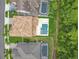 Aerial view of the home's backyard featuring a swimming pool with spa and fountain features at 8530 Vivaro Isle Way, Windermere, FL 34786