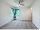 Bright bedroom with ceiling fan and neutral colored carpet at 8530 Vivaro Isle Way, Windermere, FL 34786