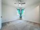 Well lit bedroom with plush carpet and large windows at 8530 Vivaro Isle Way, Windermere, FL 34786