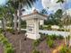 Elegant Windermere Isle community entrance sign surrounded by lush landscaping and mature palm trees at 8530 Vivaro Isle Way, Windermere, FL 34786