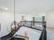 A view of the staircase and second floor hallway featuring decorative light fixtures at 8530 Vivaro Isle Way, Windermere, FL 34786