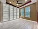 Bright office boasts custom built-ins, stylish ceiling fan, and plenty of natural light at 8530 Vivaro Isle Way, Windermere, FL 34786